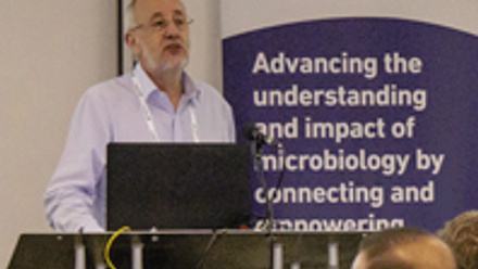 Speaker delivering a talk during Microbiology Society's Annual Conference