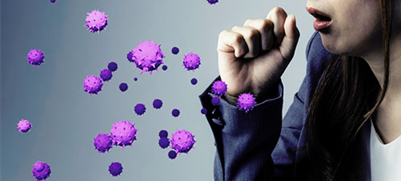 Person coughing, with hand over their mouth and large virus graphics being expelled from their cough.