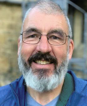 Headshot of Greggory.