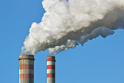 Smoke coming out two chimneys