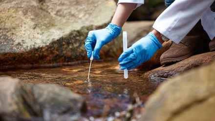 scientist with water sample