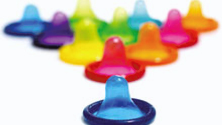 Multiple different coloured condoms.